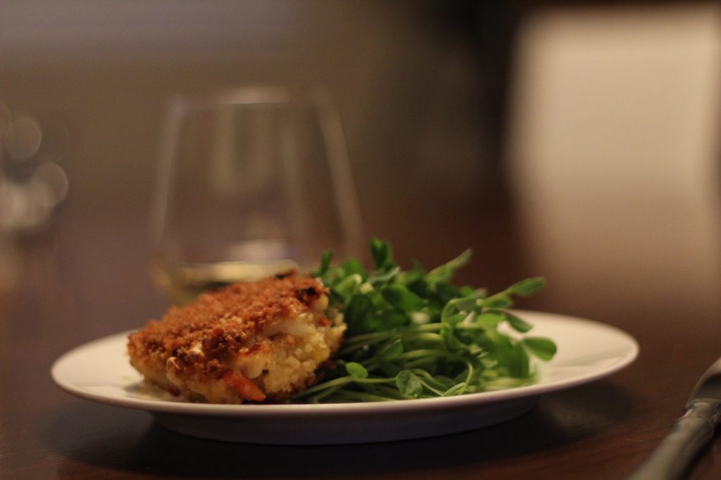 Crab Cakes Served With Pea Shoots