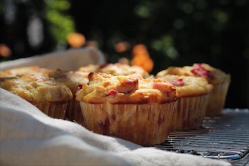 Strawberry rhubarb muffins cooling outside