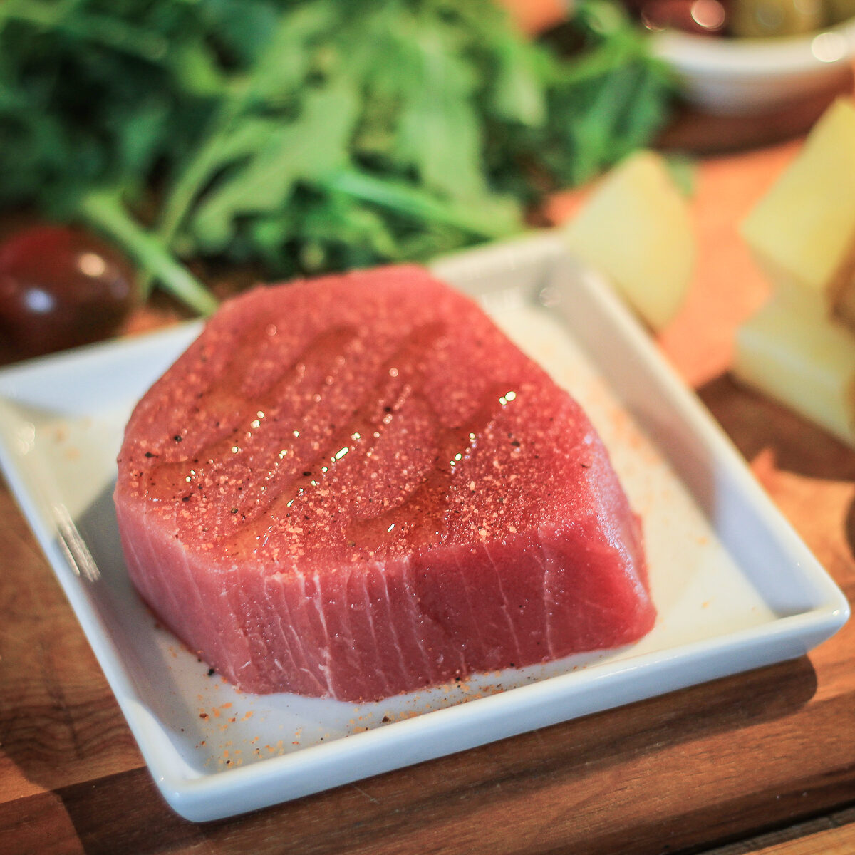 Raw tuna steak with olive oil and seasoning salt ready to cook