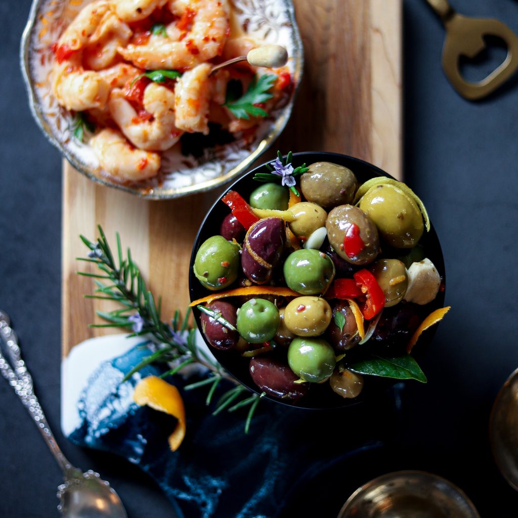 Grazing board with warm marinated olives and spicy Sardo shrimp