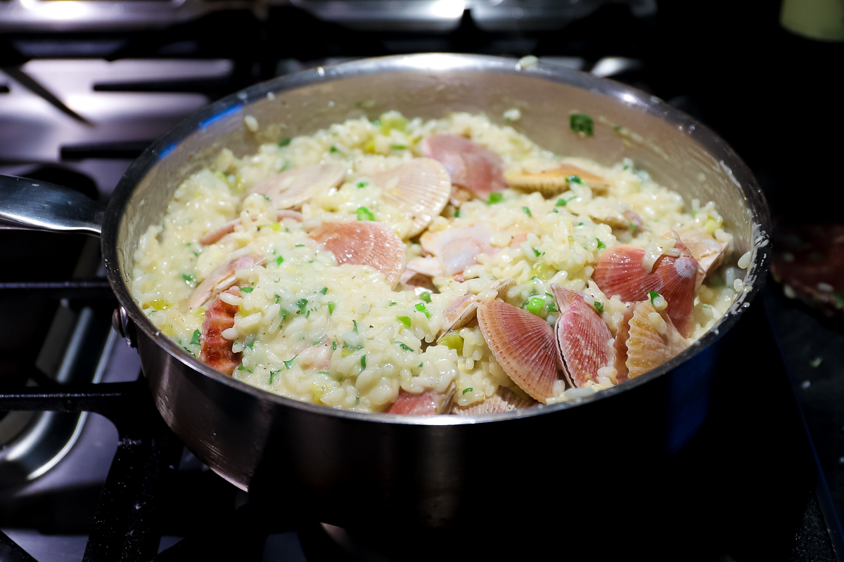 The risotto has the frozen scallops mixed in on the stove.