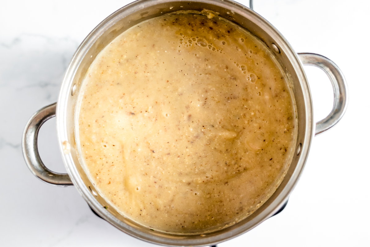 Soup has been pureed and looks smooth and is a creamy light caramel color.