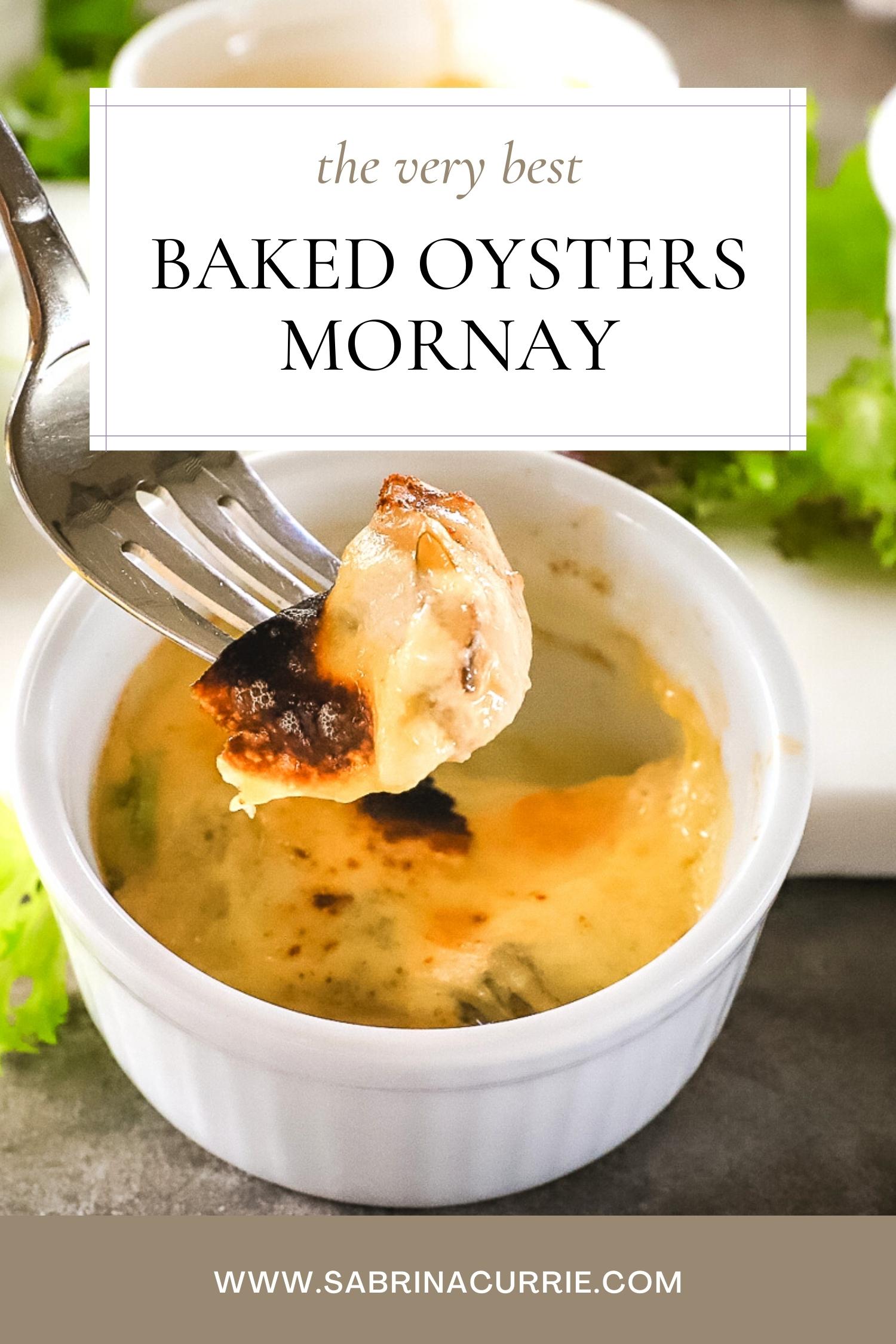 A fork with a piece of cheesy baked oyster lifted out of a white ramekin. It is a creamy yellow color with bubbly black and brown spots on top. Text box on top half of photo with recipe title, baked oysters mornay.