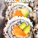 Sushi roll with rice on the outside and salmon and avocado on the inside.