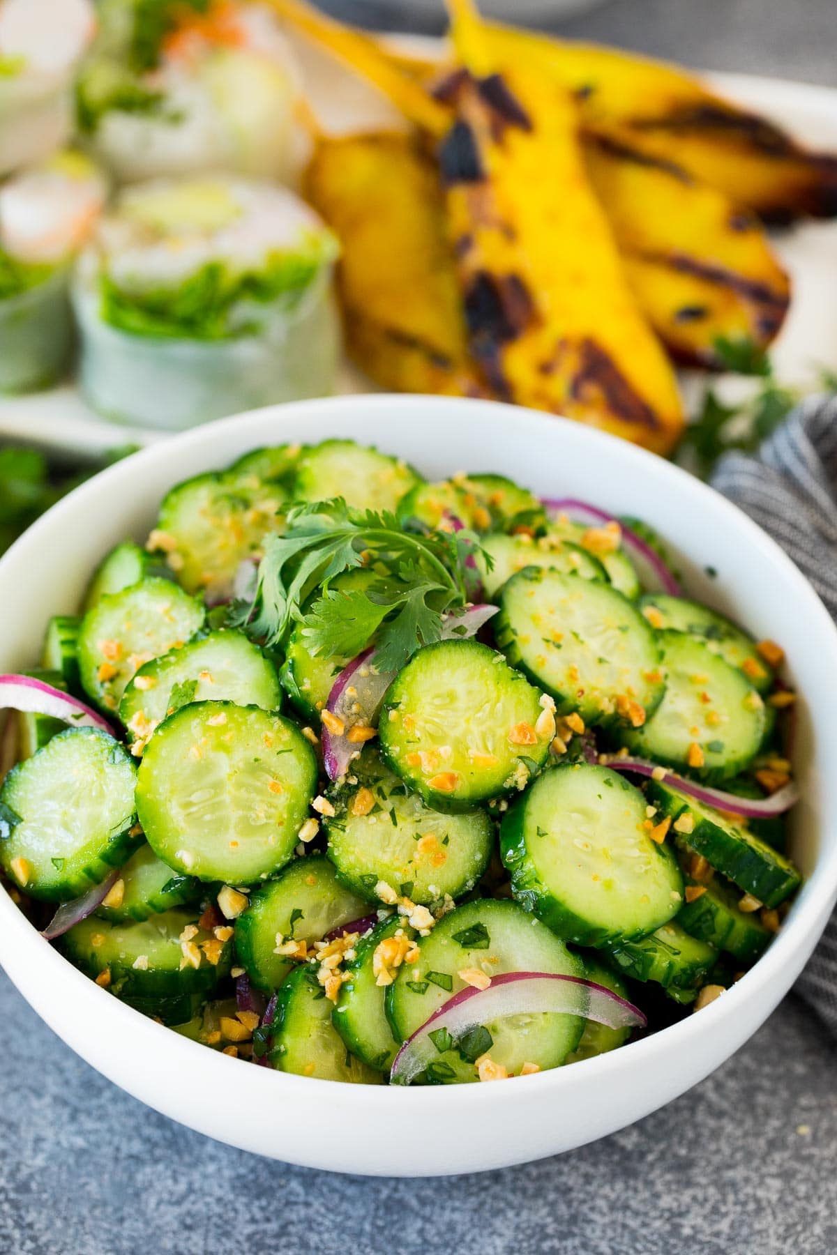 Salad of sliced cucumbers with sesame seeds.