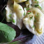 Pasta shells stuffed with crab and creamy sauce.