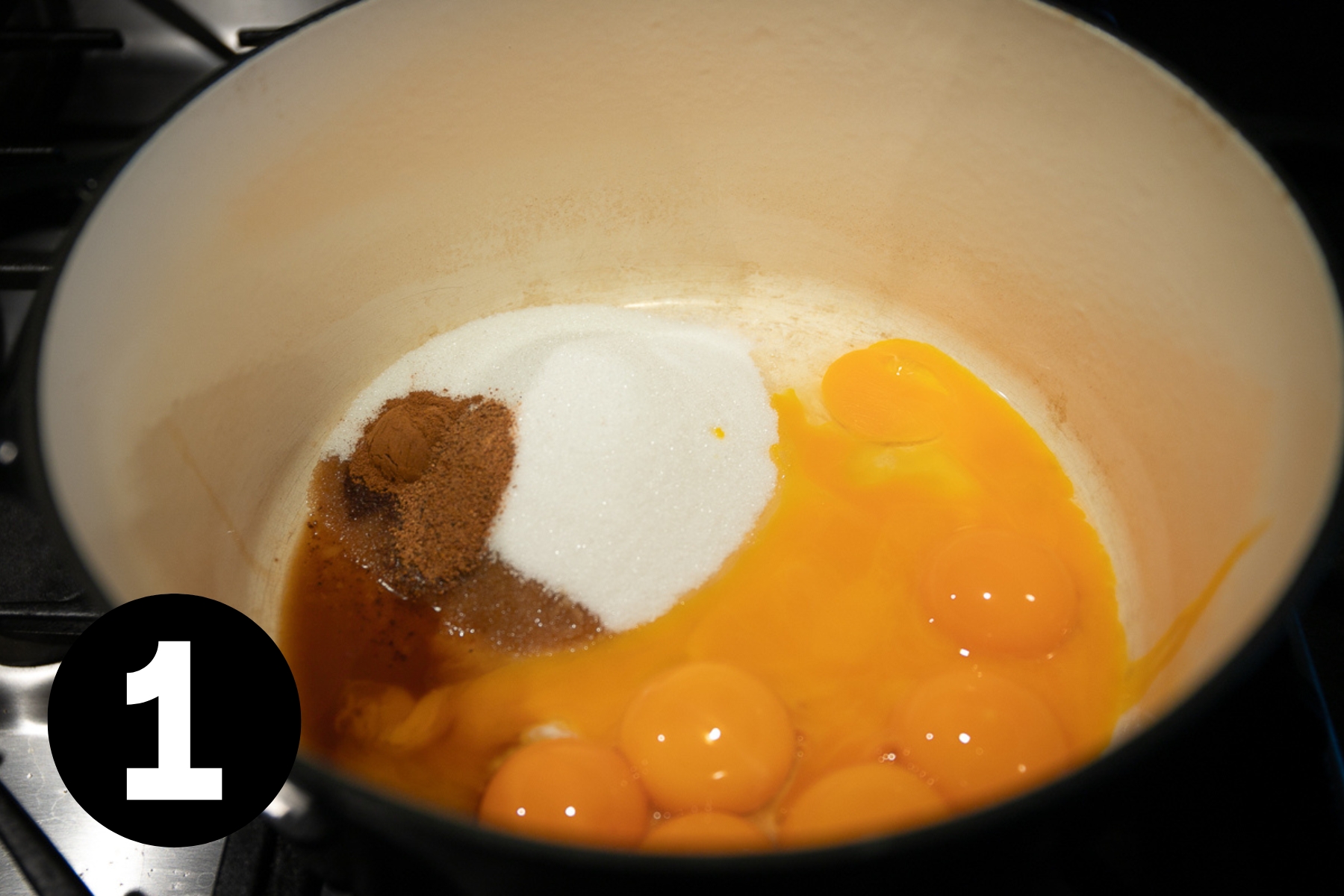 Egg yolks, vanilla extract and sugar in a large pot.