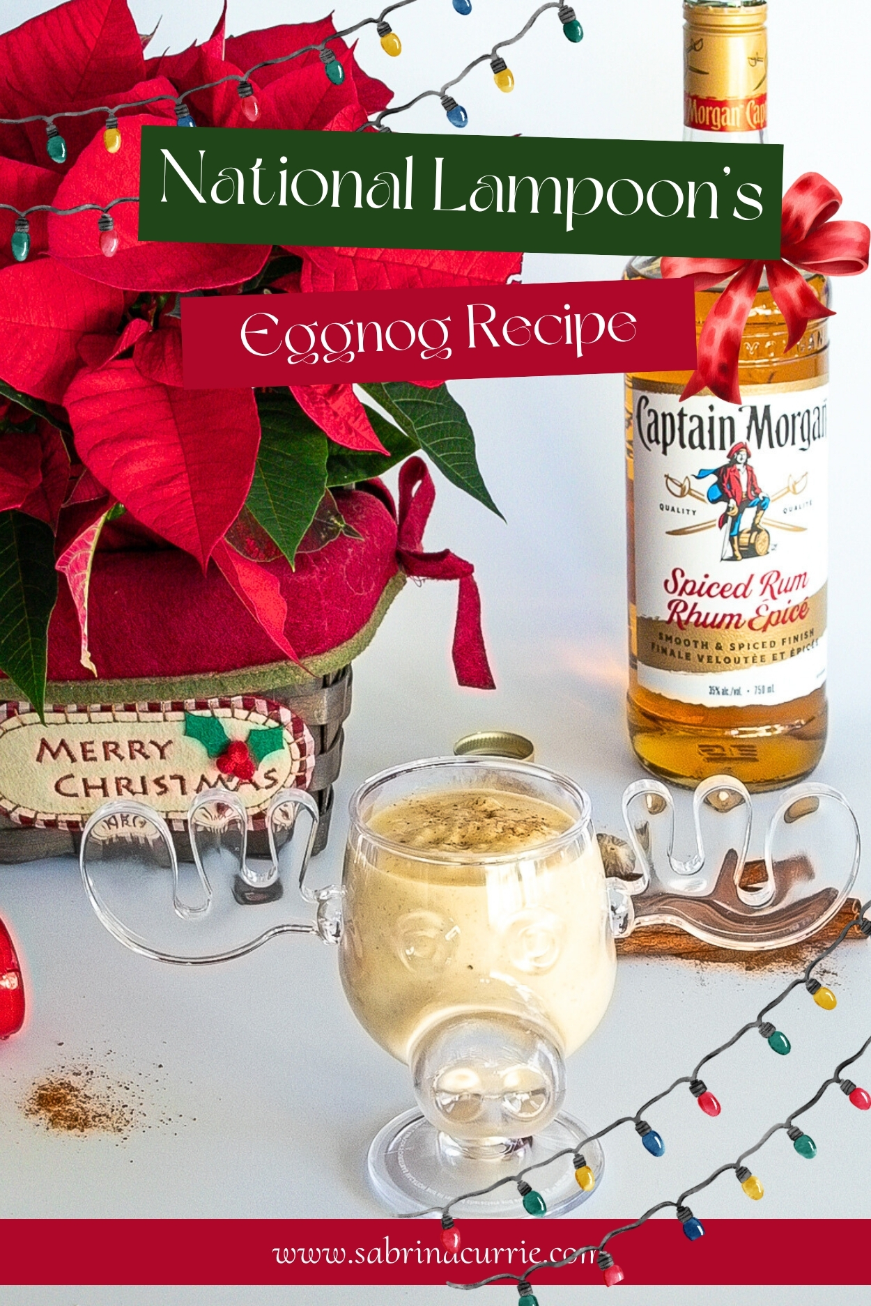 A poinsettia, a bottle of rum and a moose mug of eggnog with festive Christmas colors and lights.