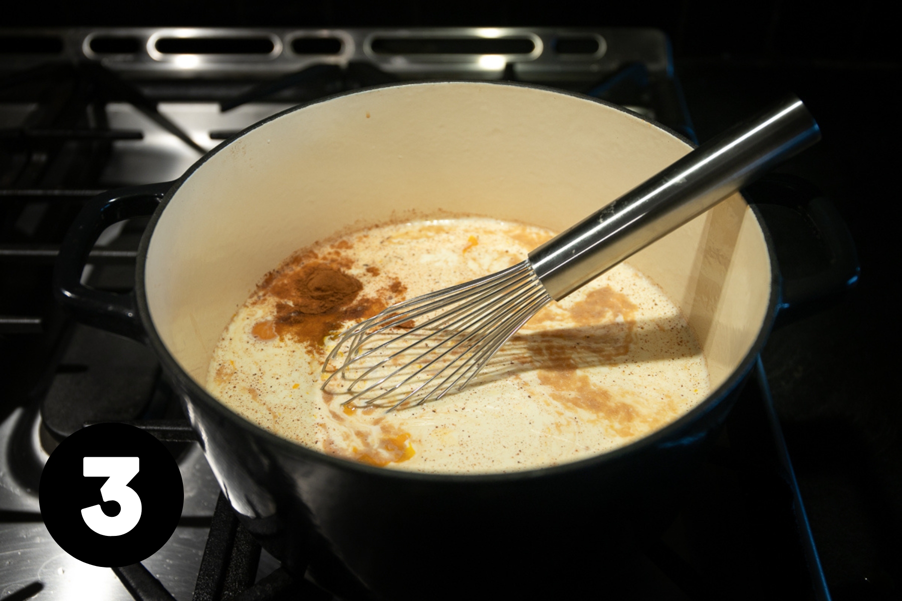 The ingredients are whisked together in a large pot and it looks creamy with the grated cinnamon and nutmeg floating on top.