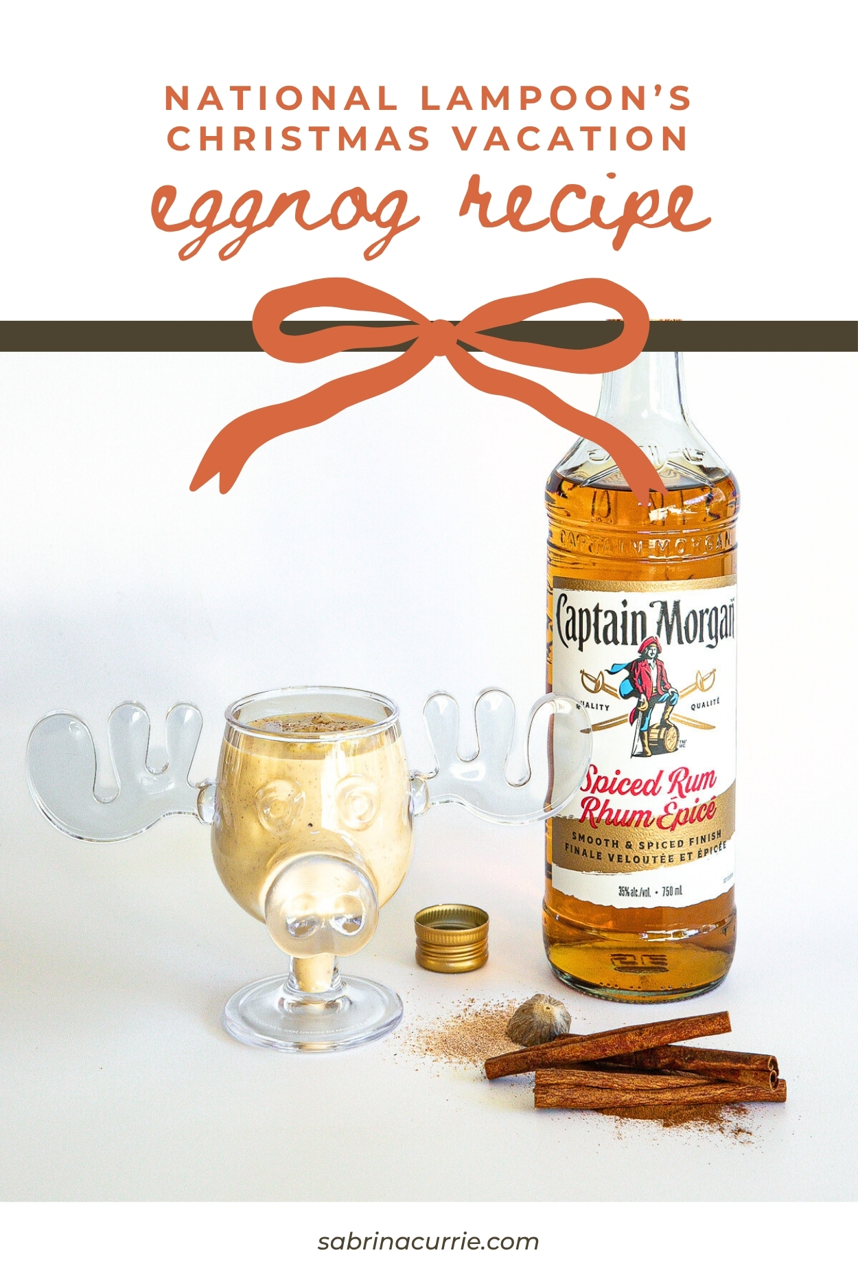 A bottle of rum and a glass of eggnog.