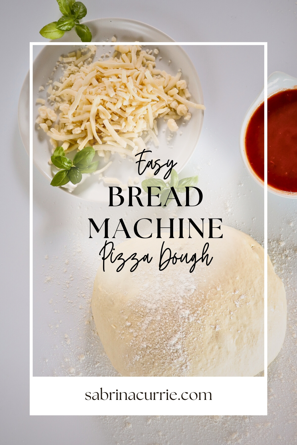 A pizza dough ball, a plate of shredded mozzarella cheese, a bowl of tomato sauce and some leaves of basil.