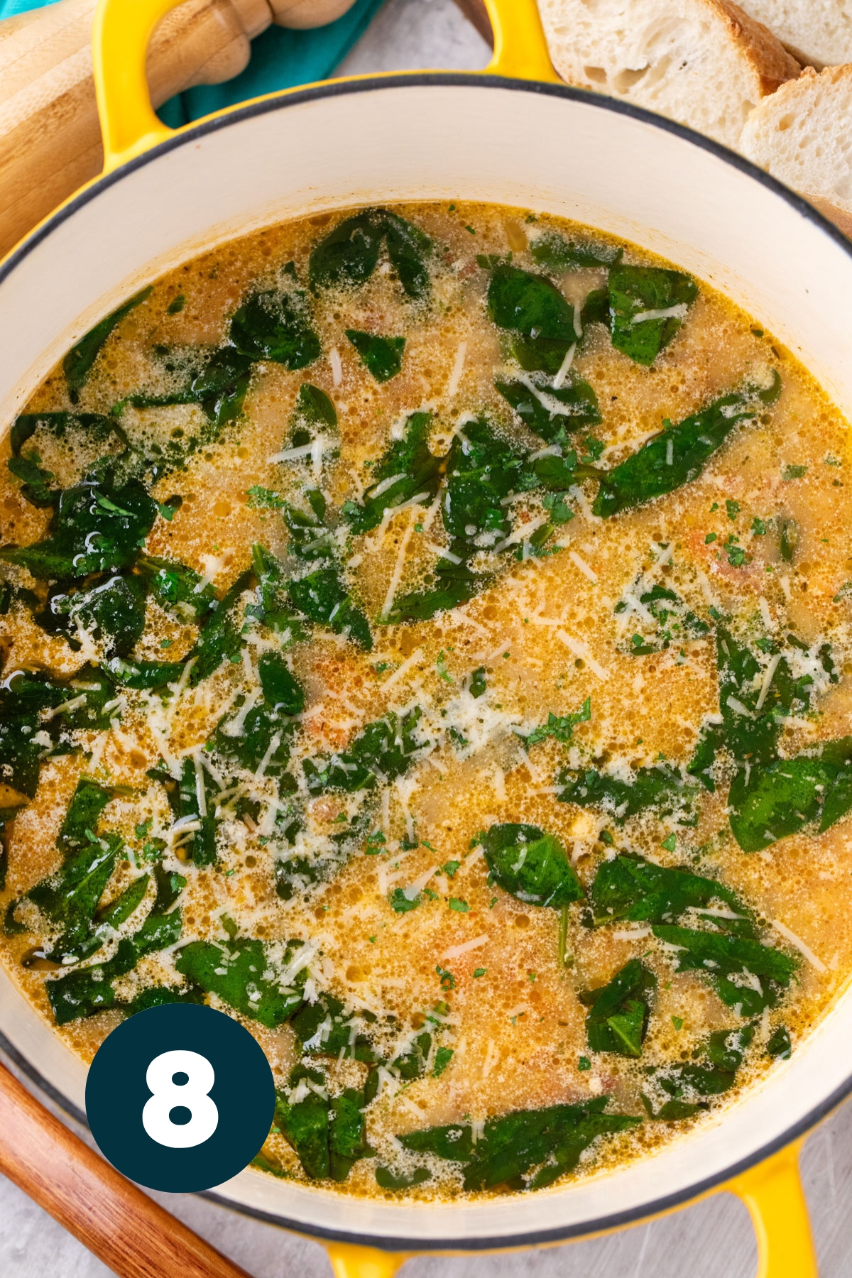 The spinach is cooked into the soup and a little parmesan cheese is sprinkled over the top as the final step.