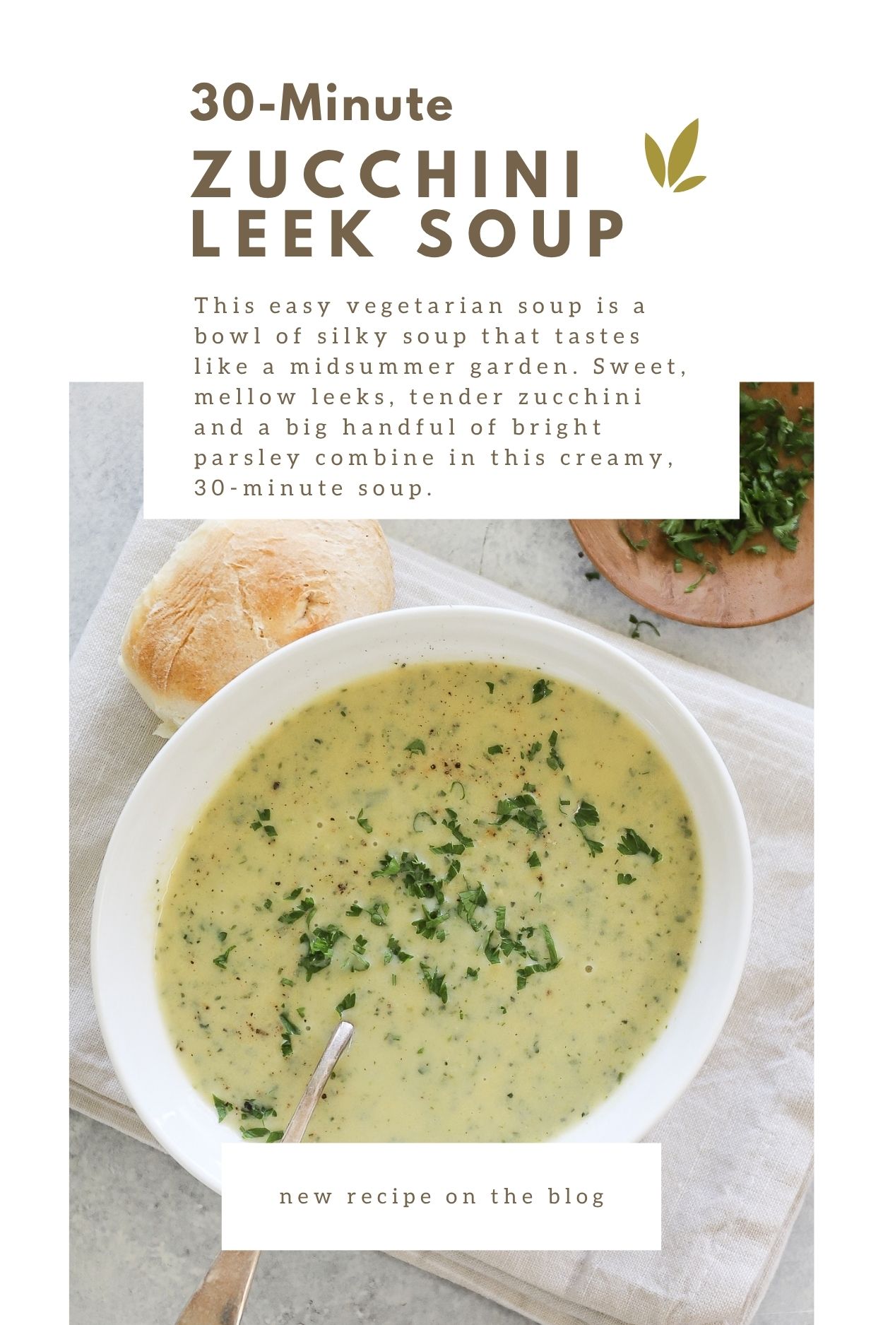 The zucchini leek soup with parsley on top beside a bun. There is a short description of the soup in a box at the top.