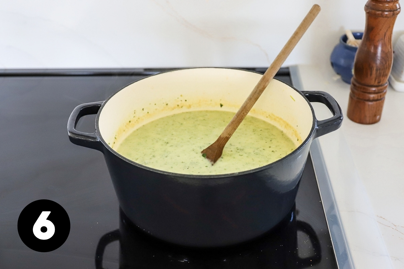 Cream has been stirred in so the soup is lighter in color.